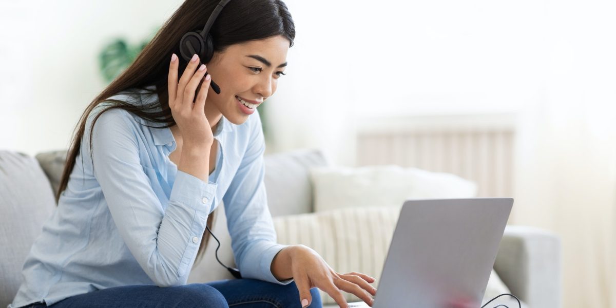 asian-woman-studying-foreign-languages-online-with-laptop-and-headset-at-home.jpg